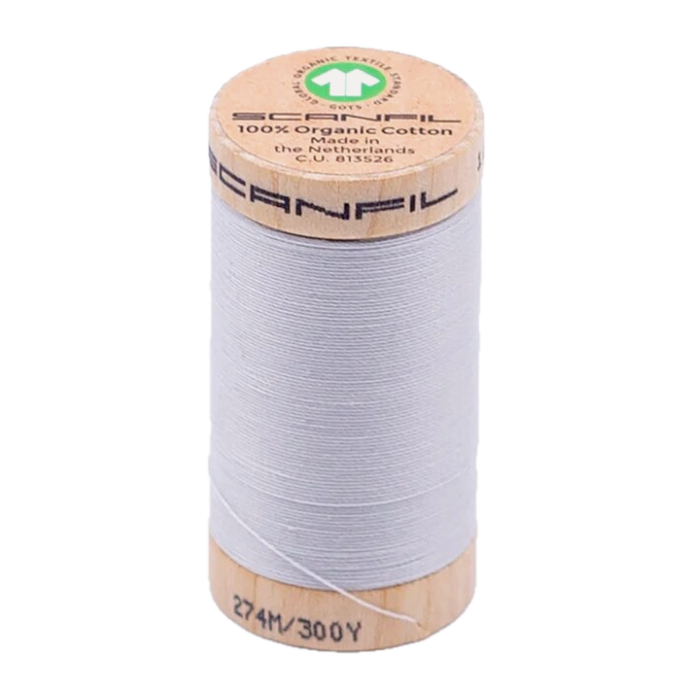 Wooden spool of organic cotton sewing thread