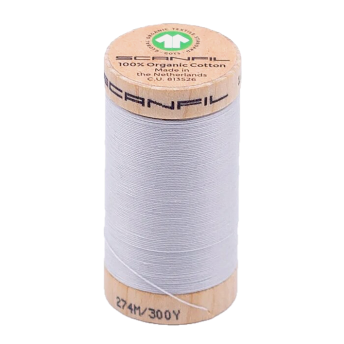 Wooden spool of organic cotton sewing thread