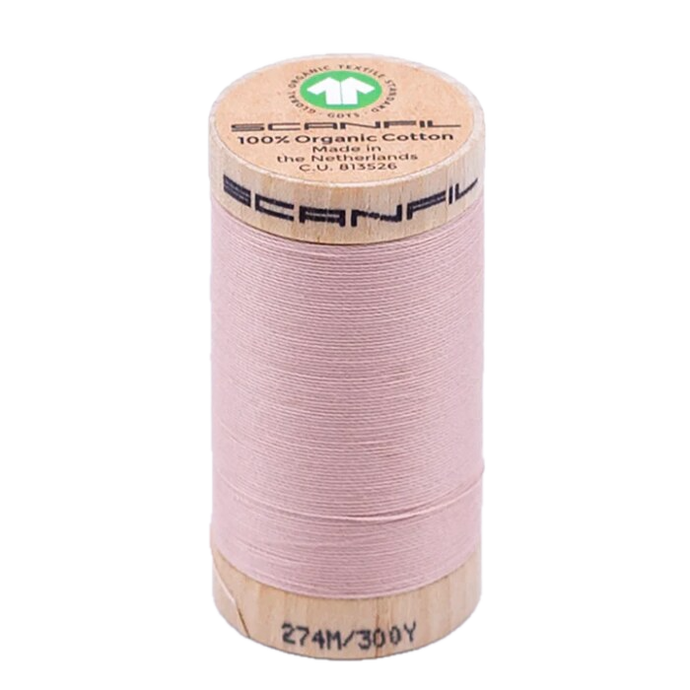 Wooden spool of organic cotton sewing thread