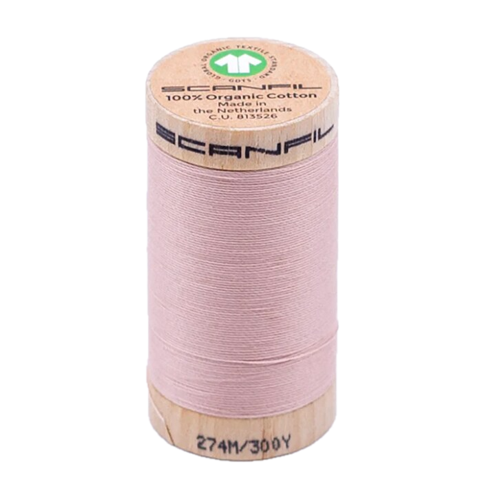 Wooden spool of organic cotton sewing thread