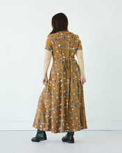 Load image into Gallery viewer, Lady wears The Shelby Dress, back view with waist tie in centre panel to cinch in waist shape
