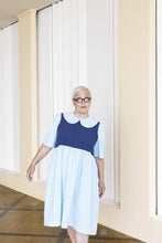 Load image into Gallery viewer, Lady wears a dress with peter pan collar, body block in contrasting colour to the rest
