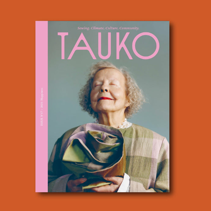 Magazine cover with a person holding a fabric rose, featuring the brand 'TAUKO'.