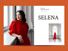 Load image into Gallery viewer, Magazine spread, with a model in a dress standing by a window with &#39;SELENA&#39; branding.

