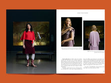 Load image into Gallery viewer, Magazine spread with image of model in a draped outfit standing in front of a painting with a magazine layout showing additional images and text.
