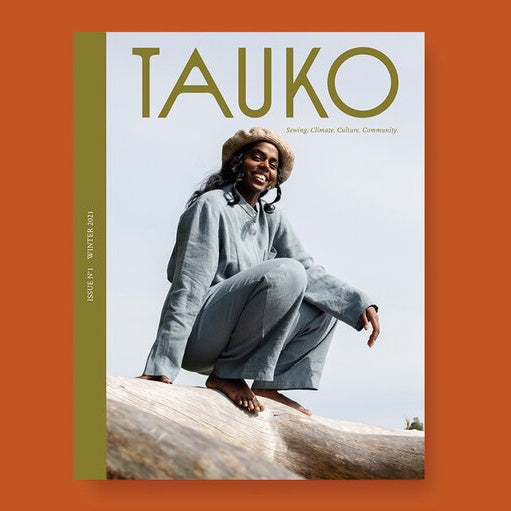 Tauko Magazine cover shows lady balancing on a log
