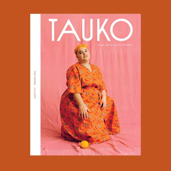 Tauko Magazine issue no 2 cover features a lady wearing a wrap-over jumpsuit