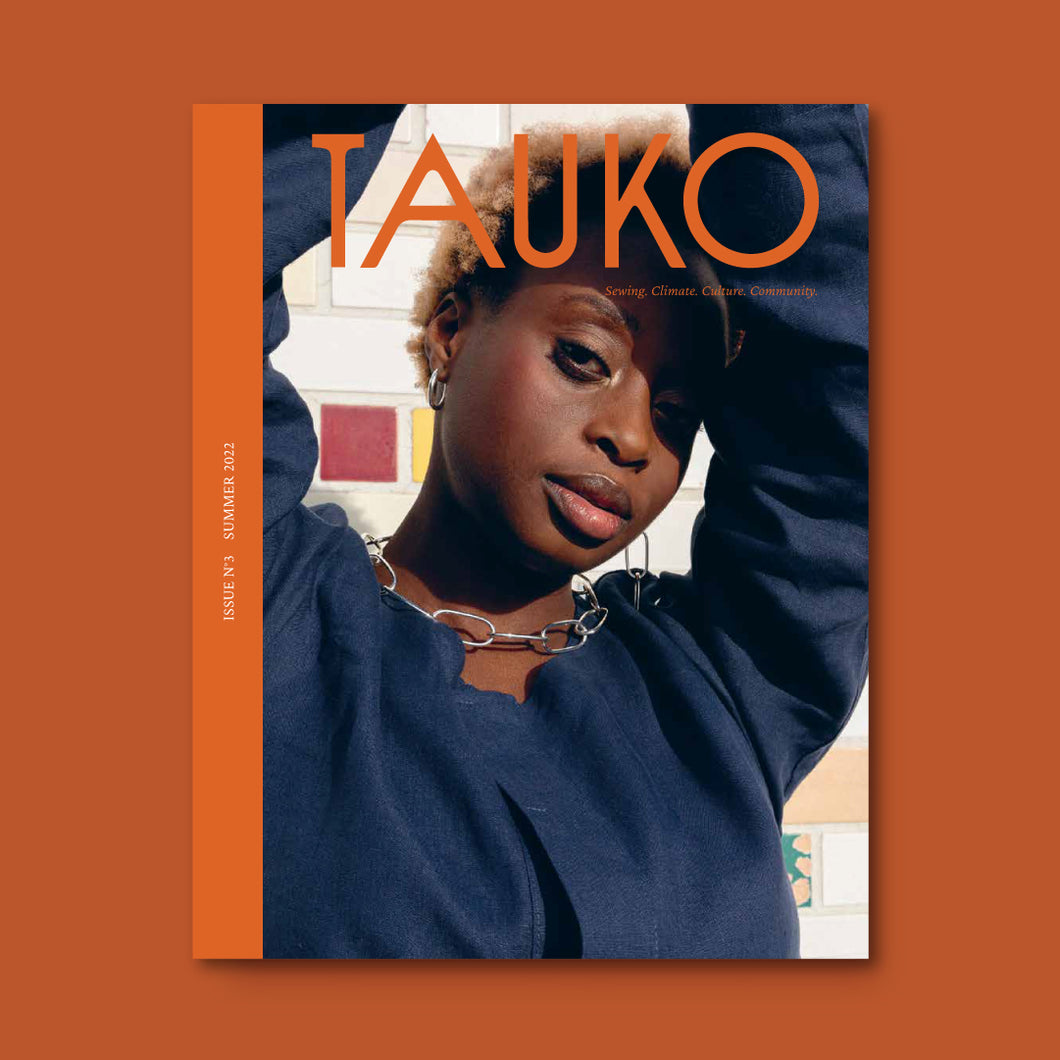 TAUKO Magazine issue no 3 Cover features lady wearing a collarless denim shirt with a large chain link necklace