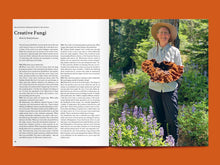 Load image into Gallery viewer, Magazine spread article titled: &quot;Creative Fungi&quot; alongside photo of lady holding up a large mushroom
