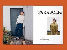 Load image into Gallery viewer, Magazine spread features a photo of lady wearing a long sleeve button fronted shirt, next to the title: &quot;Parabolic&quot;.
