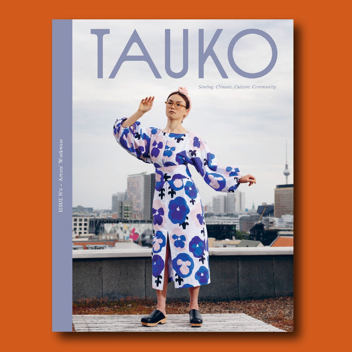 TAUKO magazine issue no 6 cover features lady on rooftop wears a long puffy sleeve dress with centre slit at hem
