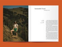 Load image into Gallery viewer, Magazine spread features photo of lady summer hiking, alongside article titled: &quot;Sustainable Travel&quot;.
