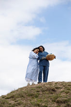 Load image into Gallery viewer, Two ladies stand on rock wearing wrap-across robes 
