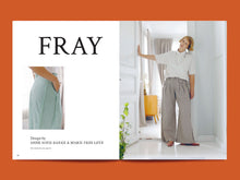 Load image into Gallery viewer, Two page magazine layout features an image of a model wearing a white shirt and pleated-waist trousers with 'Fray' branding.
