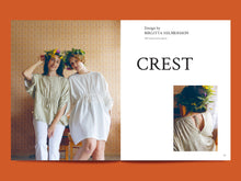 Load image into Gallery viewer, Two page magazine layout features image of two models in loose tunic tops with elasticated pull at under bust detail. Worn with floral headbands, featuring the brand 'CREST'.
