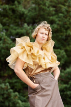 Load image into Gallery viewer, Model wears a large ruffled top

