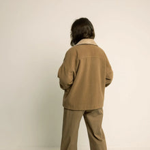 Load image into Gallery viewer, Back view of model wearing a short coat shows the dropped shoulder seams and deep back yoke
