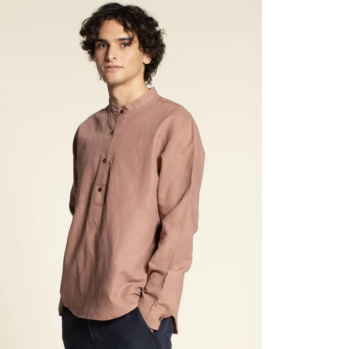 Model wears a long sleeve shirt with half placket and collar stand