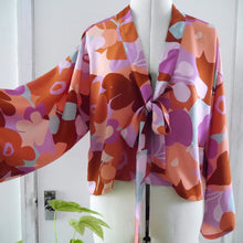 Load image into Gallery viewer, V-Neck Blouse with neck tie, displayed on mannequin, made with Trail Brown Viscose Fabric
