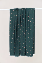 Load image into Gallery viewer, Dot print EcoVero Viscose Crepe Fabric hangs over a rail

