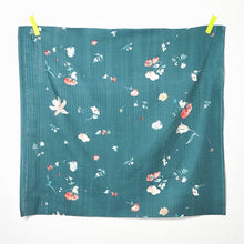 Load image into Gallery viewer, Square of Organic Cotton Double Gauze fabric with florals floating around hangs by tape pieces on top two corners

