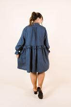 Load image into Gallery viewer, Back view of lady wearing Ashling long sleeved dress, with frilled waistline, frill cuffs, knee-length skirt
