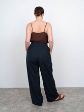 Load image into Gallery viewer, Back view of high waisted trousers, wide leg.
