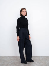 Load image into Gallery viewer, Lady stands wearing high waisted trousers, wide leg with pleats at waistline
