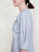 Load image into Gallery viewer, Close of of sleeve with inverted pleat at cuff, elbow length.
