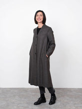 Load image into Gallery viewer, Lady stands wearing V-Neck Coat fastened with 3 buttons down centre front. Hands in inseam side pockets
