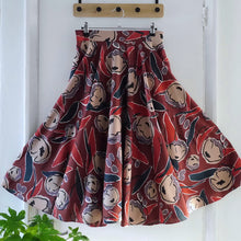Load image into Gallery viewer, Circle skirt on clippy hanger, made with Peony Rust EcoVero Viscose fabric
