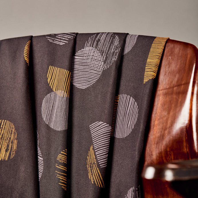 EcoVero Viscose fabric draped over the back of a chair