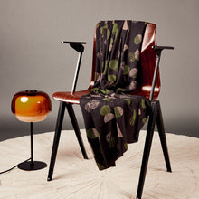 Load image into Gallery viewer, EcoVero fabric draped over a wooden chair next to a small floor lamp

