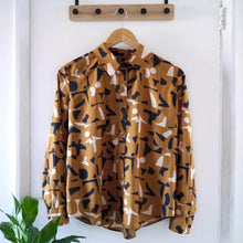 Load image into Gallery viewer, Shirt made with Shadow Ochre Viscose Modal fabric on hanger
