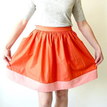 Load image into Gallery viewer, Cleo Skirt with hands holding all the fullness of the skirt
