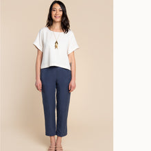 Load image into Gallery viewer, Lady stands wearing a boxy Cielo top
