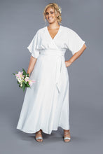 Load image into Gallery viewer, Lady wears a short sleeve full length maxi Elodie Wrap Dress carrying a bouquet of flowers
