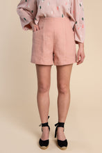 Load image into Gallery viewer, Lady wears Pietra shorts with hand in pocket
