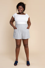 Load image into Gallery viewer, Lady wears Pietra shorts with hands in pockets
