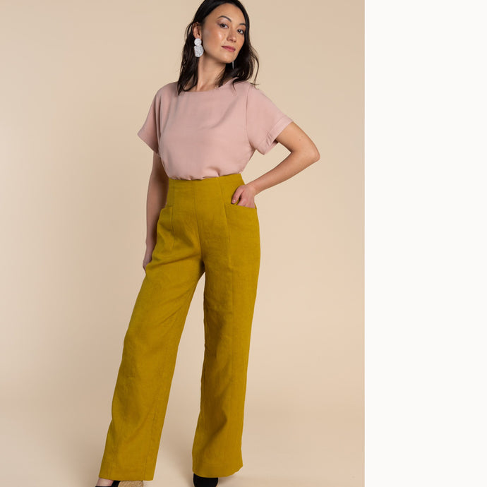 Lady wears Pietra Trousers with hand in front pocket