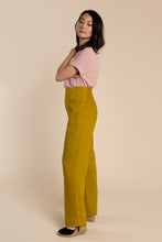 Load image into Gallery viewer, Side view of lady wearing Pietra Pants
