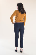 Load image into Gallery viewer, Back view of lady wearing tapered Sasha Trousers with belt
