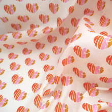 Load image into Gallery viewer, Organic Cotton Fabric slightly crumpled shows pattern of loveheart shaped &#39;hugs&#39; words
