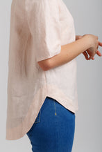 Load image into Gallery viewer, Close up side view of Dove Blouse with longer curve hem at back
