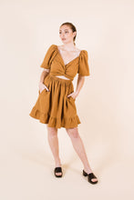 Load image into Gallery viewer, Front view of knee-length Estella dress, with an interlinked cross-over front
