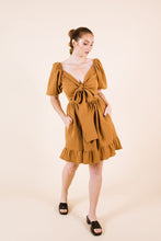Load image into Gallery viewer, Front view of knee-length Estella dress, with a cross-over front tied into a huge bow
