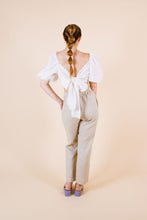 Load image into Gallery viewer, Back view of cropped top with large ties tied into a bow tie across back
