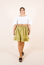 Load image into Gallery viewer, Lady wears a cropped top, with an elasticated waist, knee-length skirt with frill hem
