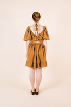 Load image into Gallery viewer, Back view of knee-length Estella Dress with cross over twist across back, cropped effect
