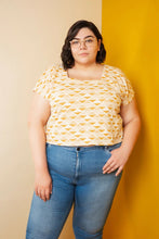 Load image into Gallery viewer, Lady stands wearing a Square Neck top which sits above waistline of jeans
